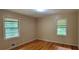 Bedroom with hardwood floors and two windows at 4643 Wesley Dr, Austell, GA 30106