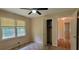 View of a bedroom with wood floors, two windows, closet, and doorway to hallway, offering functionality and light at 4643 Wesley Dr, Austell, GA 30106