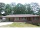 Charming one-story brick home with well-maintained lawn and covered parking at 4643 Wesley Dr, Austell, GA 30106
