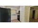 A kitchen with white cabinets and black appliances at 4643 Wesley Dr, Austell, GA 30106
