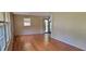 Open living room with hardwood floors and large windows at 4643 Wesley Dr, Austell, GA 30106