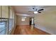 Inviting living room featuring gleaming hardwood floors, large windows and fan for comfort and natural light at 4643 Wesley Dr, Austell, GA 30106