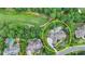 An aerial view of the home and surrounding wooded neighborhood close to the local golf course at 829 Big Horn Holw, Suwanee, GA 30024