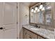Modern bathroom with granite countertop, stylish mirror, and a sleek undermount sink at 829 Big Horn Holw, Suwanee, GA 30024