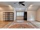 Spacious bonus room with hardwood floors, a seating area, and natural light at 829 Big Horn Holw, Suwanee, GA 30024