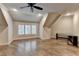 Bright bonus room featuring hardwood floors, neutral walls, and natural light at 829 Big Horn Holw, Suwanee, GA 30024
