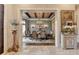 Formal dining room with elegant chandelier, wood-beamed ceiling, and stylish decor at 829 Big Horn Holw, Suwanee, GA 30024