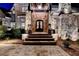 Elegant stone entrance with detailed stonework and a beautifully crafted front door at 829 Big Horn Holw, Suwanee, GA 30024