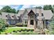 Attractive stone home with a manicured lawn and professional landscaping at 829 Big Horn Holw, Suwanee, GA 30024