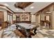The game room has a pool table, wooden accents, a bar, and decorative tiling at 829 Big Horn Holw, Suwanee, GA 30024