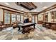 Spacious game room featuring a pool table, bar area, and hardwood floors at 829 Big Horn Holw, Suwanee, GA 30024