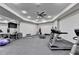 The exercise room is fully equipped with workout equipment, fans, and a TV at 829 Big Horn Holw, Suwanee, GA 30024