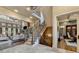 Spacious hallway with staircase and views of the living room and office at 829 Big Horn Holw, Suwanee, GA 30024