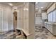 Hallway leading to laundry room with storage cabinets and bench at 829 Big Horn Holw, Suwanee, GA 30024