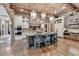 Charming kitchen with a large island, brick accents, and wood beam ceiling at 829 Big Horn Holw, Suwanee, GA 30024