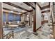 Spacious living room with stone floors, wood beam accents, and comfortable seating area at 829 Big Horn Holw, Suwanee, GA 30024