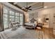 This primary bedroom features floor to ceiling windows, trey ceilings, and neutral decor at 829 Big Horn Holw, Suwanee, GA 30024