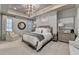 Bright main bedroom with elegant chandelier, tray ceiling, and abundant natural light at 829 Big Horn Holw, Suwanee, GA 30024