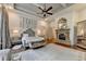 Spacious main bedroom with fireplace, tray ceiling, and decorative mirror at 829 Big Horn Holw, Suwanee, GA 30024