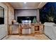 An outdoor kitchen with a stainless steel grill, counter space, storage, and stone accents at 829 Big Horn Holw, Suwanee, GA 30024
