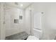 Bright bathroom with a walk-in glass shower and a toilet at 1101 Juniper Ne St # 1504, Atlanta, GA 30309