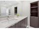 Bathroom with double sinks and a built-in shelving unit at 1101 Juniper Ne St # 1504, Atlanta, GA 30309
