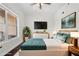 Staged bedroom featuring a large bed, window, and modern decor at 1101 Juniper Ne St # 1504, Atlanta, GA 30309