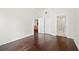 Bright bedroom featuring hardwood floors, double door closet, and white trim at 1101 Juniper Ne St # 1504, Atlanta, GA 30309