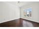 Bedroom with a bright window and ceiling fan at 1101 Juniper Ne St # 1504, Atlanta, GA 30309