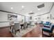 Bright dining area with seating, wood floors, modern lighting and stylish decor throughout the home at 1101 Juniper Ne St # 1504, Atlanta, GA 30309