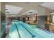 Indoor swimming pool with clear blue water, tiled floor, and large windows providing ample natural light at 1101 Juniper Ne St # 1504, Atlanta, GA 30309