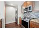 Gourmet kitchen includes modern stainless steel appliances, granite counters, and a mosaic backsplash at 1101 Juniper Ne St # 1504, Atlanta, GA 30309