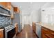 Well-equipped kitchen featuring stainless steel appliances, granite countertops and hardwood floors at 1101 Juniper Ne St # 1504, Atlanta, GA 30309