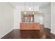Open-concept space featuring hardwood floors, pendant lighting, and kitchen with island at 1101 Juniper Ne St # 1504, Atlanta, GA 30309