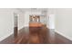 Open-concept living area featuring dark hardwood floors and a view into the kitchen at 1101 Juniper Ne St # 1504, Atlanta, GA 30309