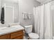 Well-lit bathroom with a tub and shower combination featuring a shower curtain at 1644 Cutters Mill Dr, Lithonia, GA 30058