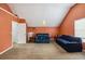 Spacious bedroom with a vaulted ceiling, carpet floors, and bathed in natural light at 1644 Cutters Mill Dr, Lithonia, GA 30058