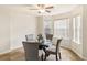 Bright dining room with decorative ceiling fan and table by a window at 1644 Cutters Mill Dr, Lithonia, GA 30058
