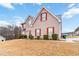 Two-story house with red shutters, a well-kept lawn, and beautiful curb appeal at 1644 Cutters Mill Dr, Lithonia, GA 30058