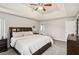 Main bedroom with tray ceiling and ensuite bathroom entrance at 1644 Cutters Mill Dr, Lithonia, GA 30058