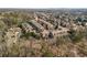 Aerial view highlighting the community's setting, surrounded by lush greenery and other established homes in the neighborhood at 2009 Kensington Green Se Dr, Smyrna, GA 30080
