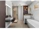 Modern bathroom featuring a sleek floating vanity, glass-enclosed shower, and elegant soaking tub, creating a spa-like ambiance at 2009 Kensington Green Se Dr, Smyrna, GA 30080