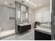 Modern bathroom with dual vanity, stylish tile accents, a spacious walk-in shower, and lots of natural light at 2009 Kensington Green Se Dr, Smyrna, GA 30080