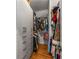 Walk-in closet with custom shelving and hardwood floors, perfect for organized storage and showcasing wardrobe at 2009 Kensington Green Se Dr, Smyrna, GA 30080