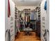 Organized walk-in closet with custom shelving, hanging rods, and drawers, maximizing storage and organization at 2009 Kensington Green Se Dr, Smyrna, GA 30080