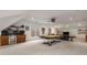 Open game room with a pool table, wet bar, and built-in shelves, perfect for entertaining guests and enjoying leisure time at 2009 Kensington Green Se Dr, Smyrna, GA 30080