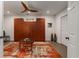 Stylish living area with custom built-in storage, modern ceiling fan, and a decorative area rug at 2009 Kensington Green Se Dr, Smyrna, GA 30080
