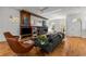 Stylish living room with a modern fireplace, hardwood floors, and comfortable seating arrangement at 2009 Kensington Green Se Dr, Smyrna, GA 30080