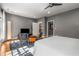 This well-lit main bedroom offers neutral walls and ample natural light, with a comfortable sitting area at 2009 Kensington Green Se Dr, Smyrna, GA 30080