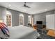 This spacious main bedroom is illuminated by natural light from arched windows, with hardwood flooring and neutral tones at 2009 Kensington Green Se Dr, Smyrna, GA 30080